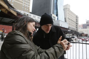  Jackie Spinner shows student Alex Wroblewski a smartphone photo app during a photojournalism class at Columbia College Chicago on a day when it was so cold the students' smartphones shut off. CREDIT: Charles Osgood.