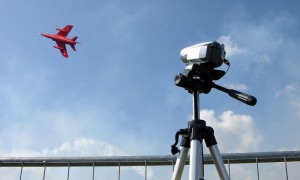 Camcorder being used at an air show.