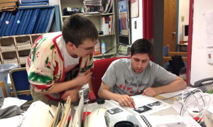 Former editor-in-chief Scott Girard and former managing editor Alex DiTullio look over the final pages of the Daily Cardinal, one of the University of Wisconsin-Madison's independent student newspapers.